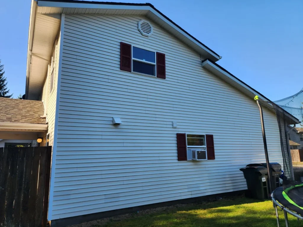 White house with red shutters and windows